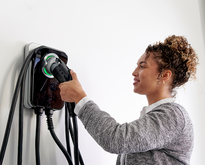 EV using smart charging in a residential garage at night